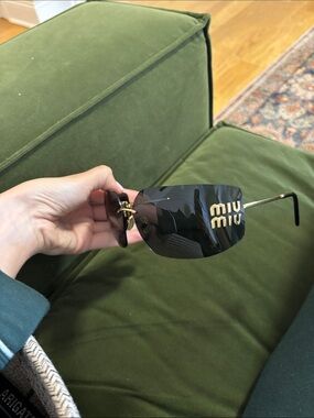 Miu Miu Black Rimless Sunglasses with Gold Logo Accent